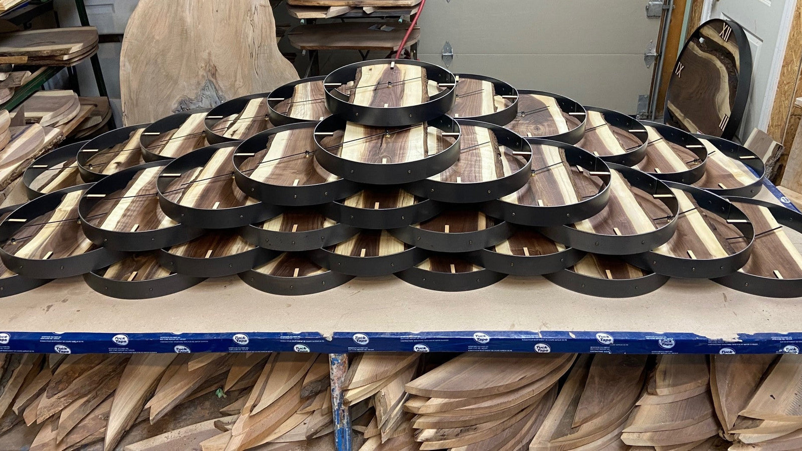 Collection of handcrafted live edge wood clocks in various wood grains